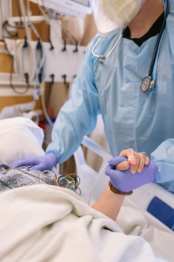 Adventist Health Hanford - nurse holding patient hand